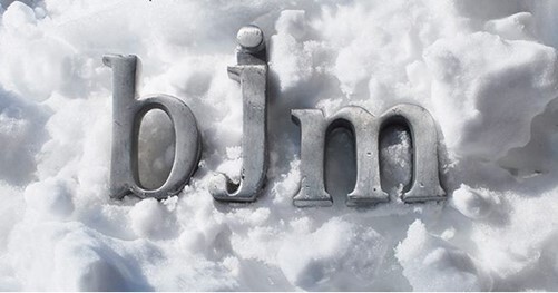 bjm in gray letter with snow in the background.